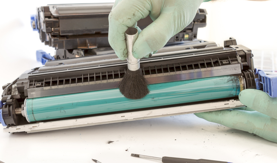 hands cleaning toner cartridge